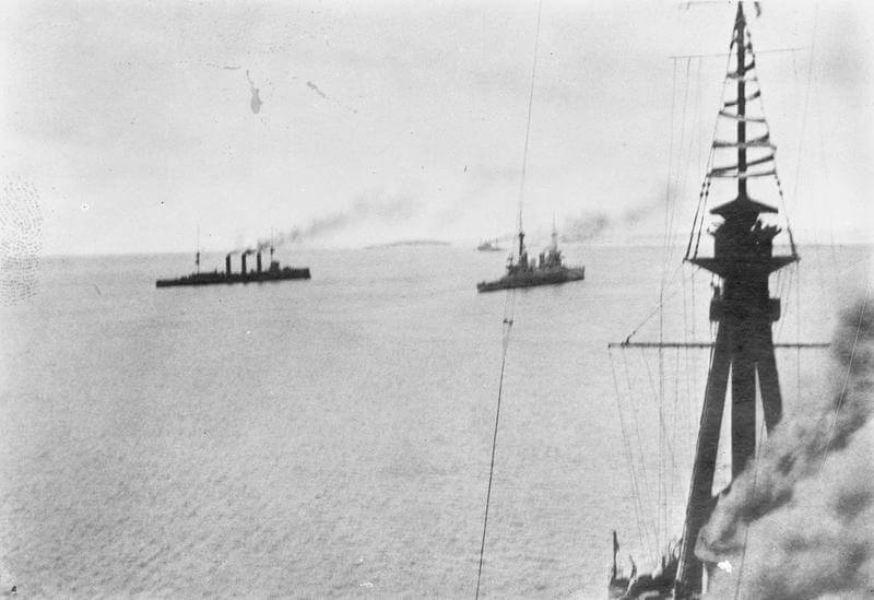 HMS Kent, Glasgow and Inflexible. Photograph taken by Paymaster Sub-Lieutenant Duckworth RN from HMS Invincible at the beginning of the Battle of the Falkland Islands on 8th December 1914.