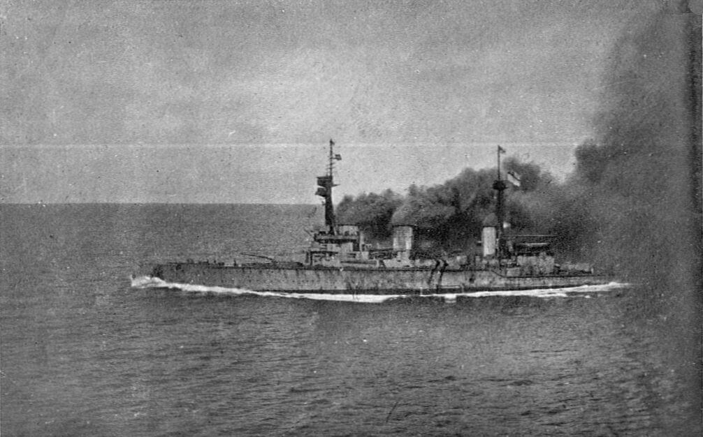 HMS Invincible under way and giving off clouds of black smoke at the beginning of the Battle of the Falkland Islands on 8th December 1914