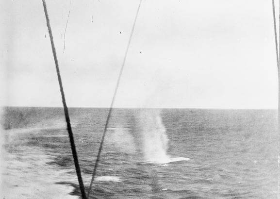 Shots fired by SMS Scharnhorst landing in the sea behind HMS Invincible during the Battle of the Falkland Islands on 8th December 1914. Photograph taken by Paymaster Sub-Lieutenant Duckworth RN from HMS Invincible