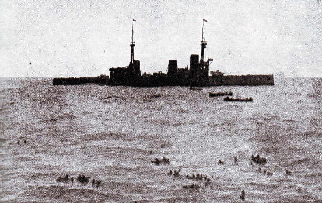 HMS Inflexible picking up survivors from SMS Gneisenau at the end of the Battle of the Falkland Islands on 8th December 1914. Photograph taken by Paymaster Sub-Lieutenant Duckworth RN from HMS Invincible
