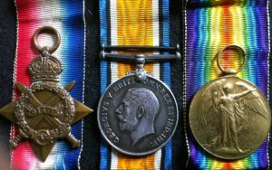 Medals and Plaque commemorating the Battle of Coronel awarded for Stoker 2nd Class John Smith. R.N. of HMS Good Hope, killed in action at the Battle of Coronel on 1st November 1914 in the First World War