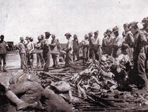 British troops clearing the battlefield of bodies and abandoned weapons after the Battle of Modder River on 28th November 1899