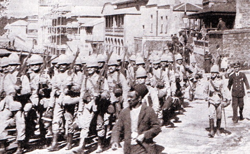 Royal Marines from HMS Doris in Cape Town. Captain Senior is marching on the right. Senior was killed in the storming of the Boer position by the Naval Brigade in the Battle of Graspan on 25th November 1899