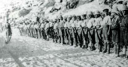 1st Royal Munster Fusiliers holding a roll call 18 days after the landing at V Beach Cape Helles on 25th April 1915: present were 5 officer and 372 men out of the battalion’s original strength of 25 officers and 900 men