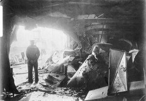 Sailor standing in the hole blown in the side of German Battle Cruiser SMS Derfflinger during the Battle of Jutland 31st May 1916