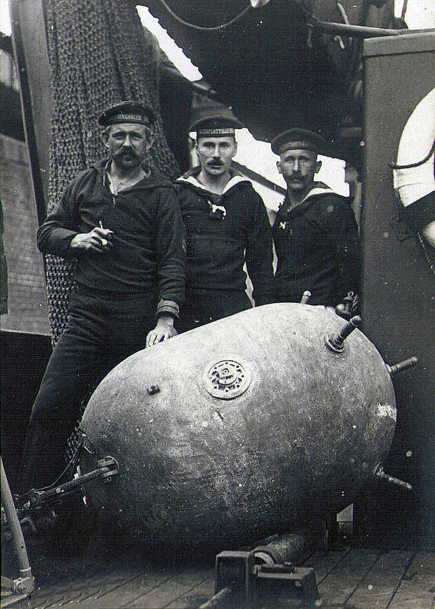 German sailors preparing a mine for launching on a minelayer